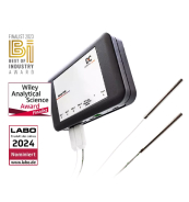 Image of a compact analytical device with two temperature probes, featuring award badges for industry recognition.